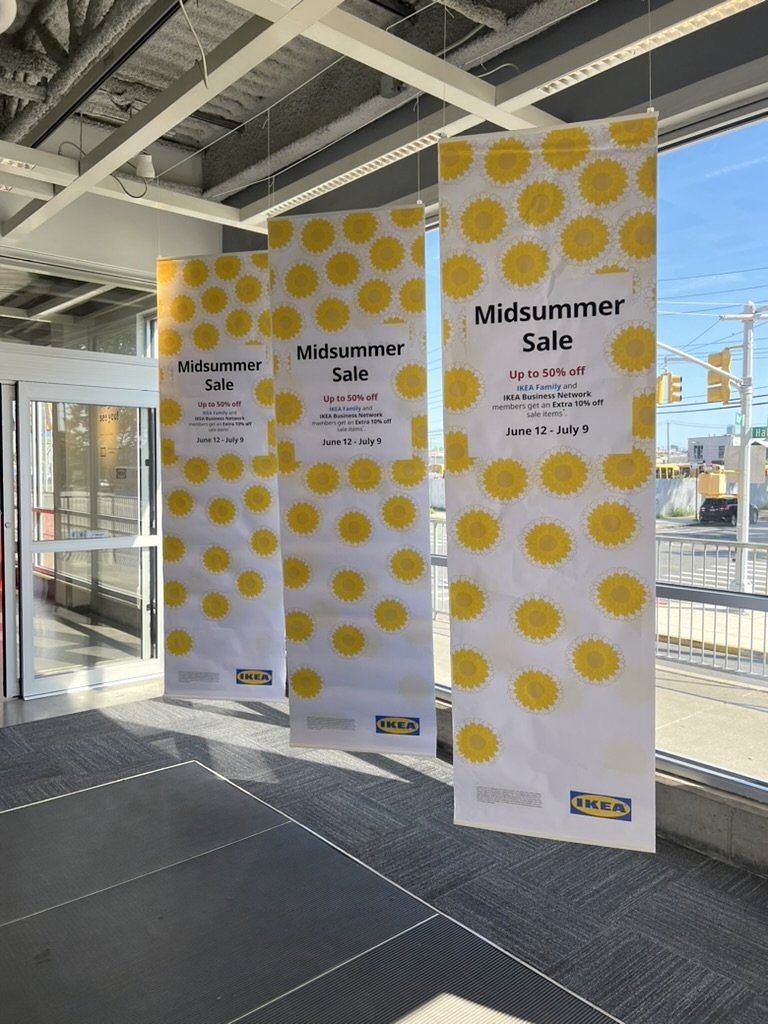 Midsummer sale banners at the store entrance